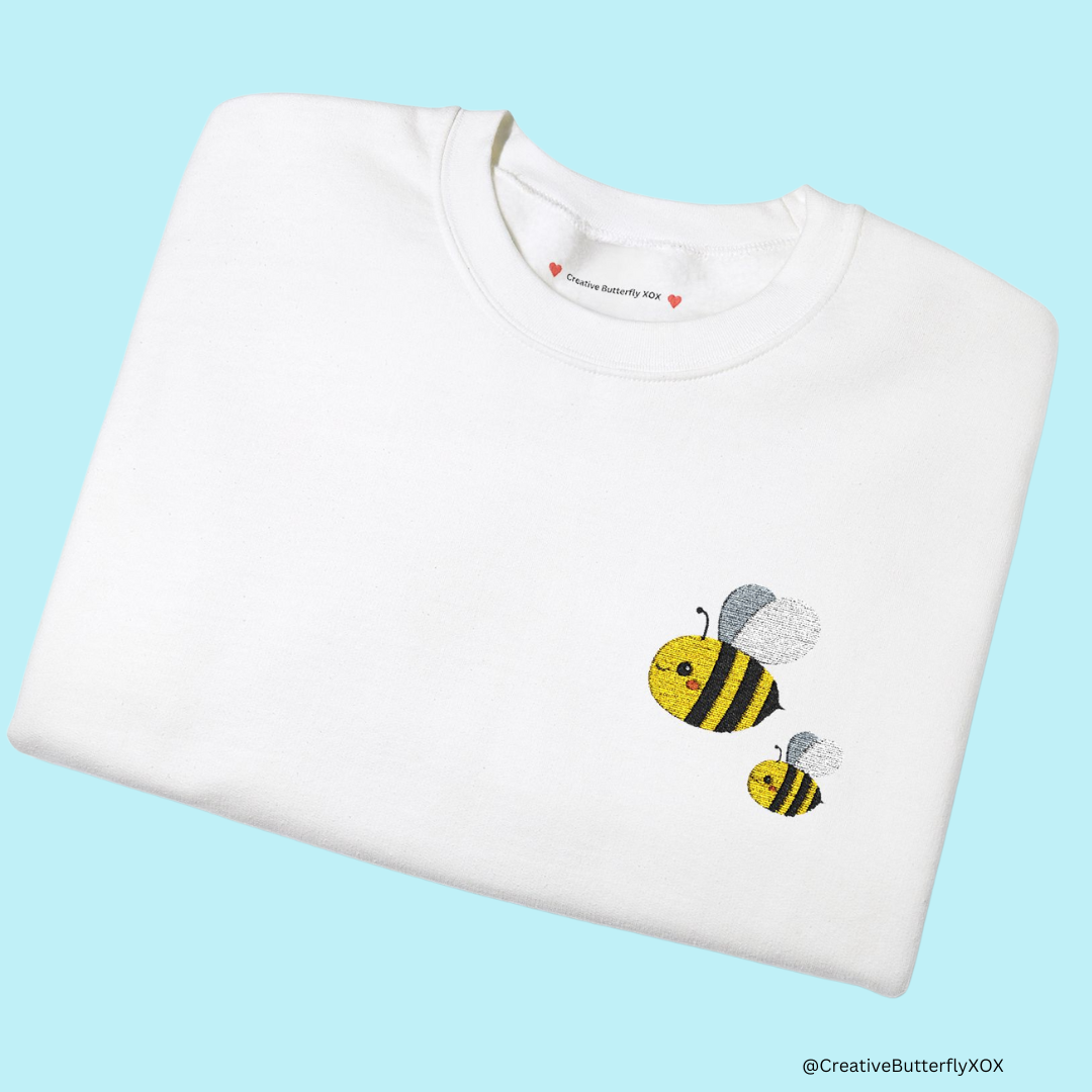 Bumblebee embroidery sweatshirt, cozy pullover for bee lovers - folded close up view color white
