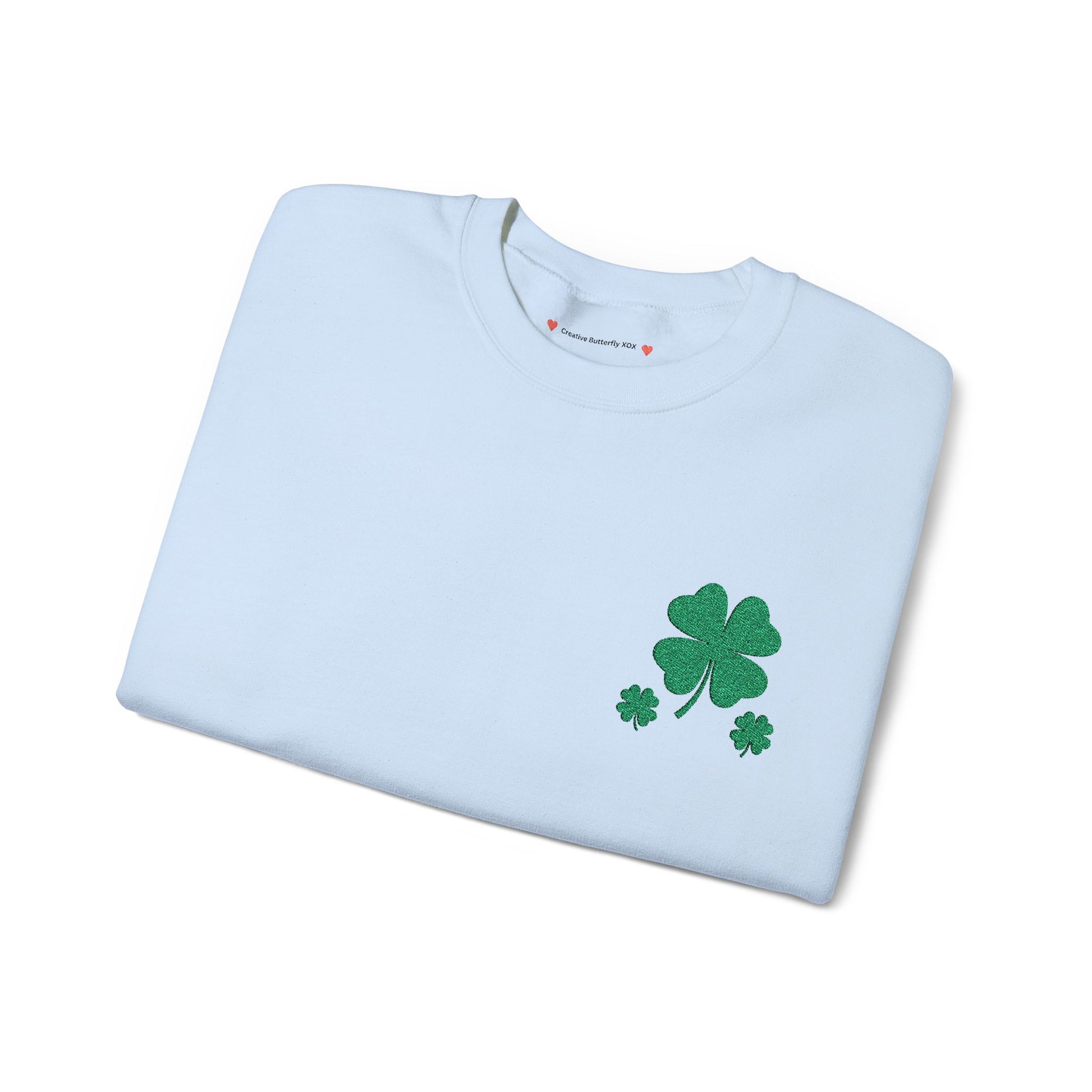 Light blue folded view - Grey folded sweatshirt view - St. Paddy’s Day pullover sweatshirt with a simple four-leaf clover design