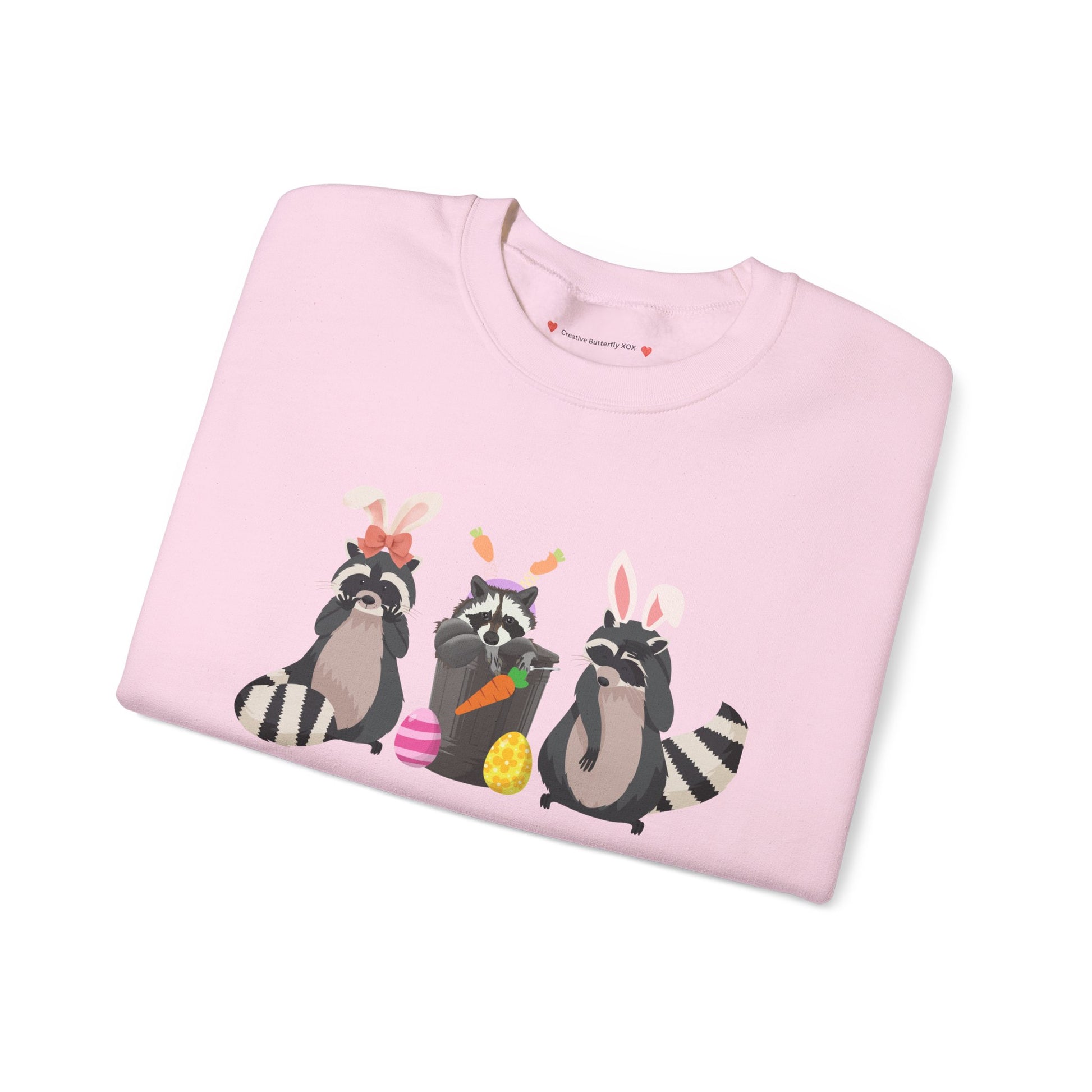 Trash panda raccoons Easter sweatshirt sweater with pastel colors and adorable raccoon easter bunny design - color light pink close up