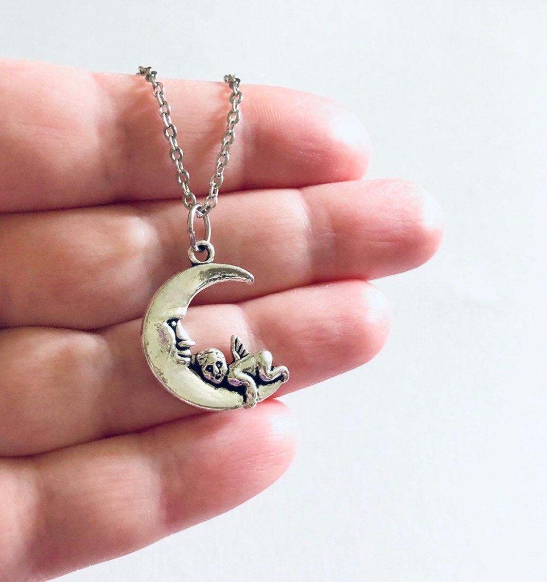 Silver Cherub Moon Necklace, Dainty Chain with Angel Charm on Crescent Moon Celestial Wicca Witchy Woman